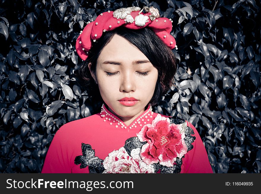 Woman With Her Eyes Closed Wearing Pink Floral Top