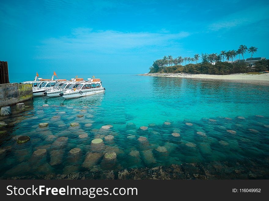 White Boats On Body Of Water