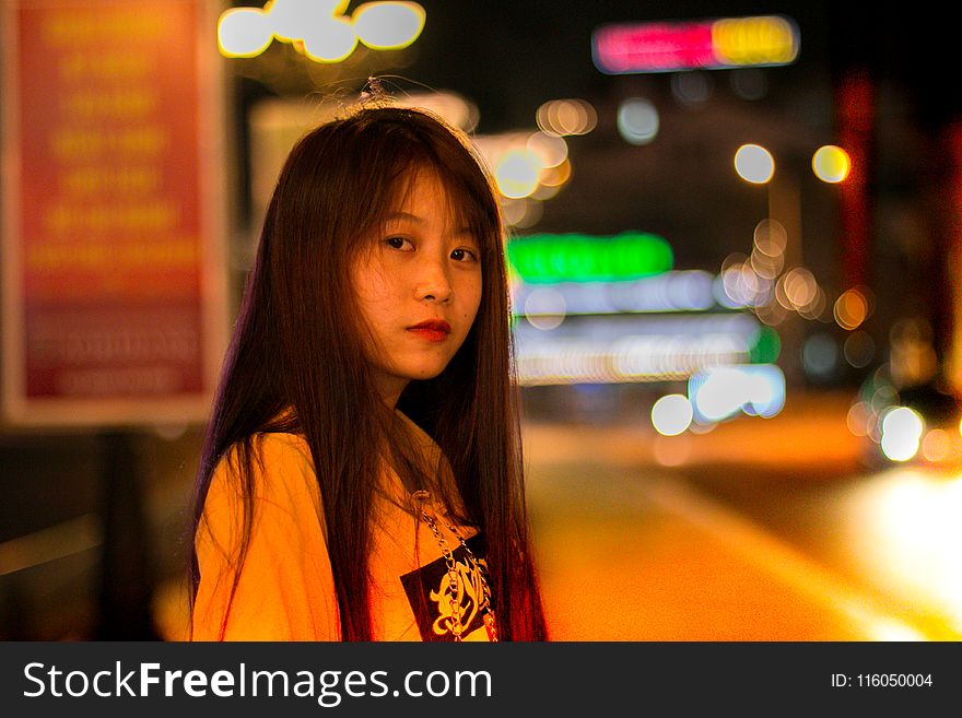 Selective Focus Photo Of Woman Wearing Yellow Shirt