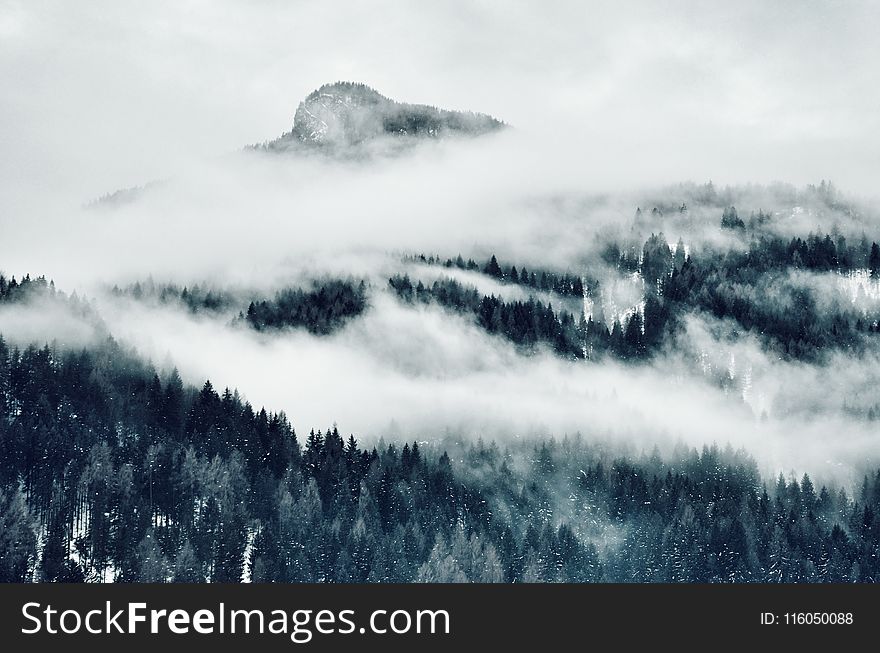 High Angle Photo of Mountain Cover With Clouds