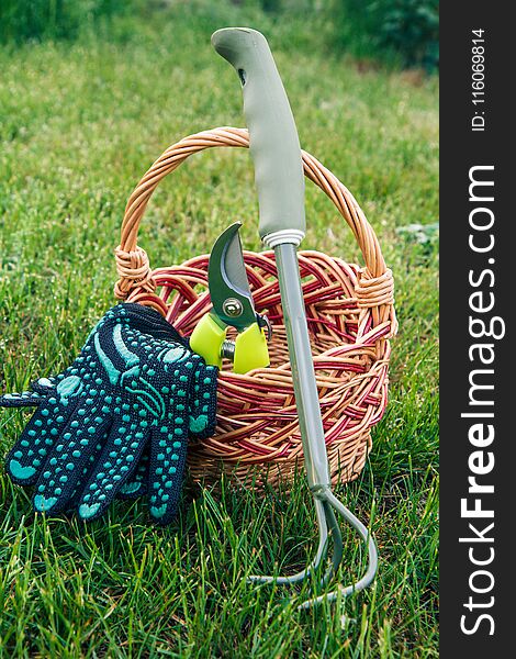 Small Hand Garden Rake, Pruner And Gloves With Wicker Basket In