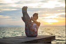 Woman Pose Yoga On Wooden Pier At Sea Side Against Beautiful Sun Royalty Free Stock Photography Woman Pose Yoga On Wooden Pier At Sea Side Against Beautiful Sun Royalty Free Stock Photography