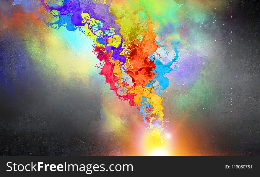 Colored paint splashes on dark cloud background. Colored paint splashes on dark cloud background