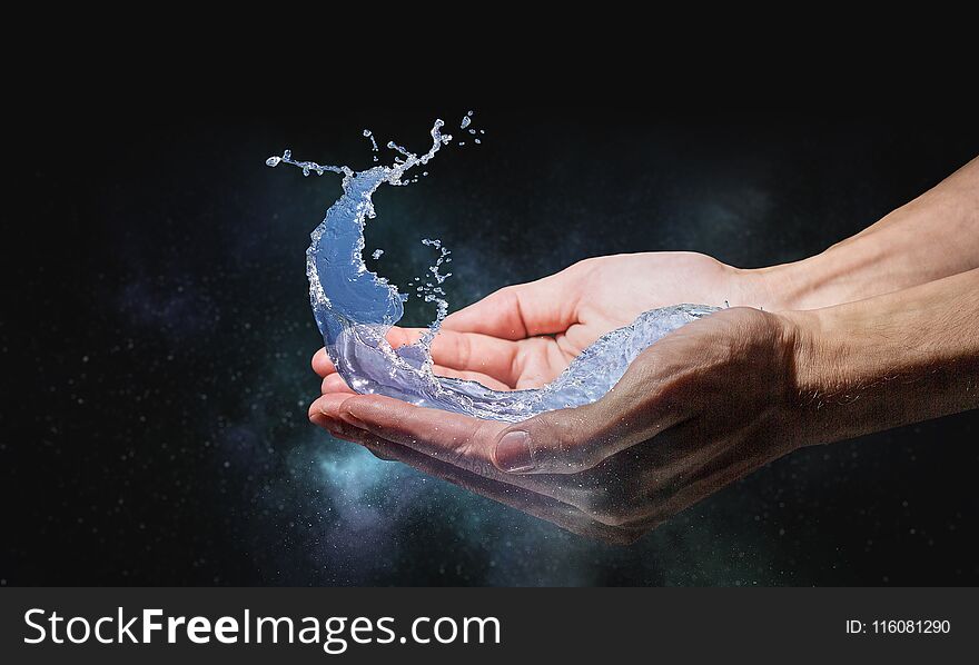 Close of person hands holding water splashes. Close of person hands holding water splashes