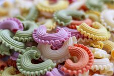 Background Of Colorful Green, Yellow, White, Orange And Pink Italian Crown Pasta Stock Image Background Of Colorful Green, Yellow, White, Orange And Pink Italian Crown Pasta Stock Image