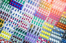 Colorful Of Tablets And Capsules Pill In Blister Packaging Arranged With Beautiful Pattern With Flare Light. Pharmaceutical Stock Photography