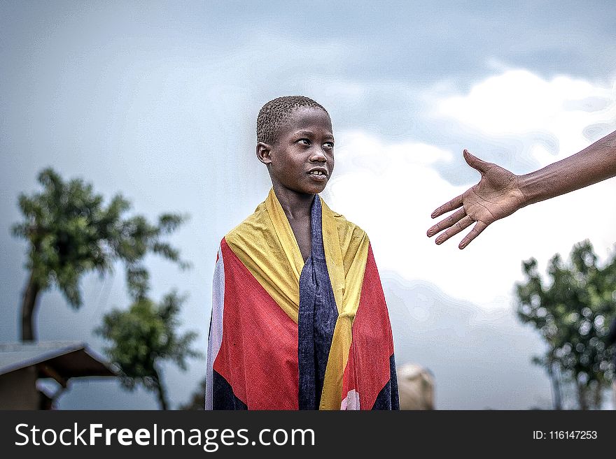 Person Wearing Red And Yellow Textile