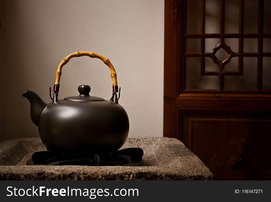 Unused Teapot on Side Table