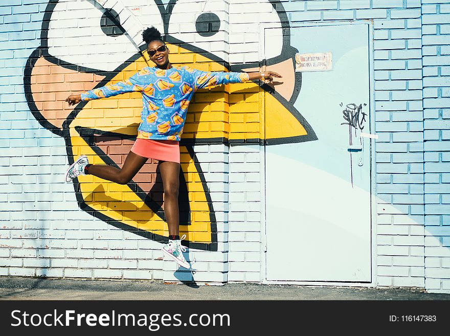 Girl In Blue Sweatshirt And Pink Skit In Jumpshot Photo