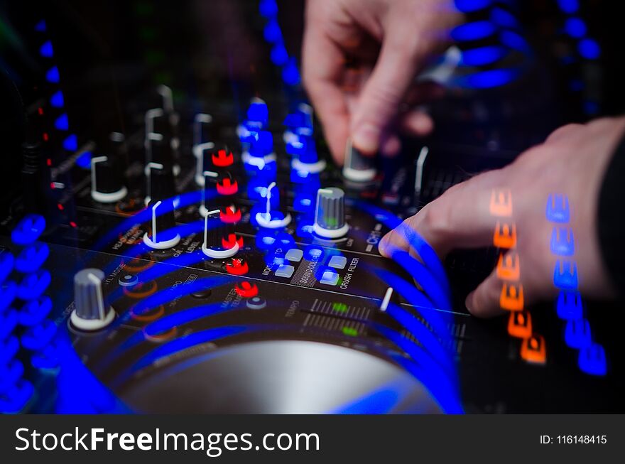 DJ Music night club. DJ set. Working hands