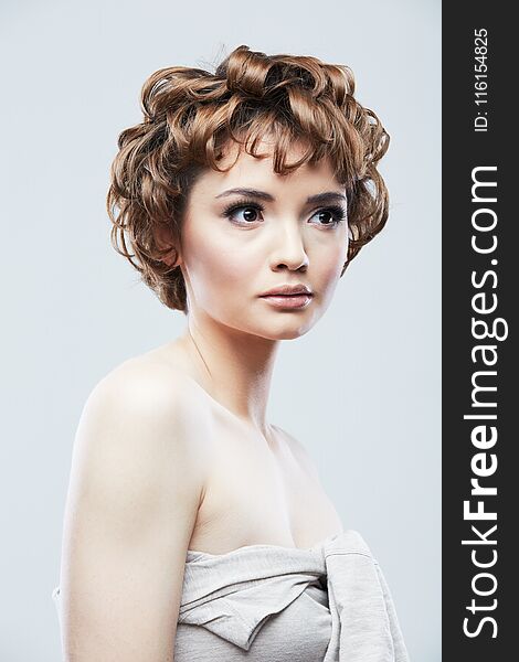 Young woman close up face beauty portrait.Short Hair style. Female model isolaed white background.