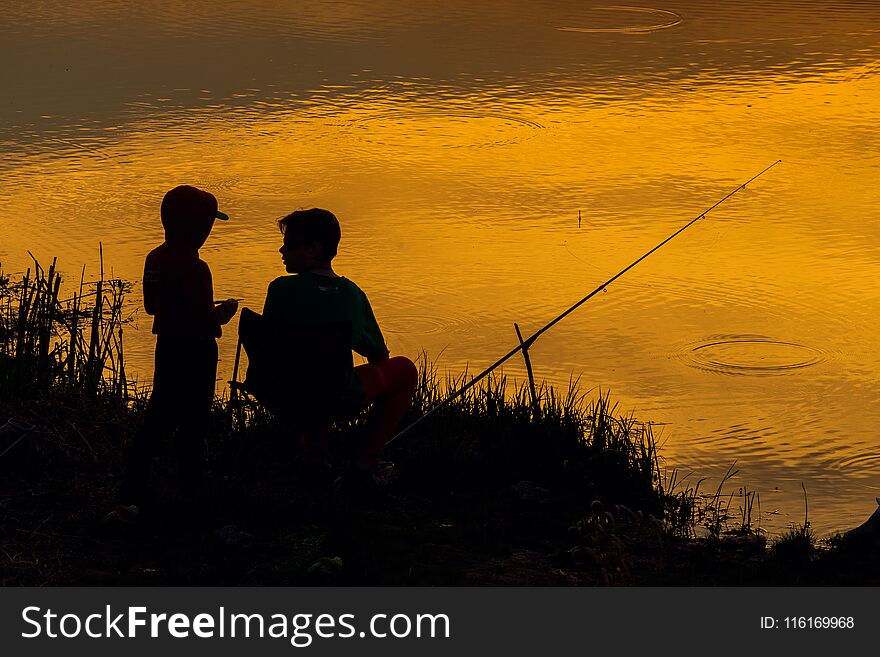 Sunset fishermans silhouette landscape