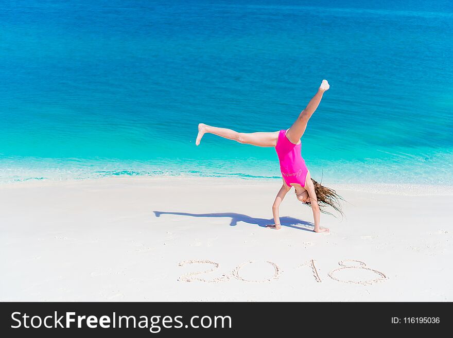 Cute little girl in hat at beach during caribbean vacation