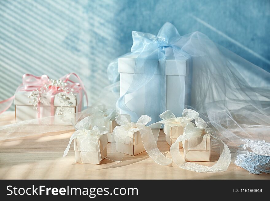 Composition of gift boxes with bows on light background