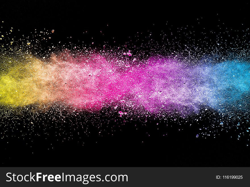 Explosion of multicolored dust on black background. Explosion of multicolored dust on black background.