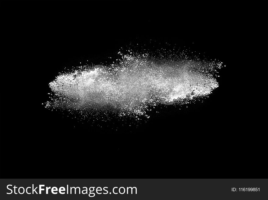 Explosion of white dust on black background. Explosion of white dust on black background.