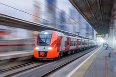 High Speed Train Rides At High Speed At The Railway Station In The City. Royalty Free Stock Photography
