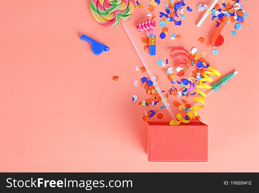 Colorful party frame with birthday objets on orange background. Celebration concept