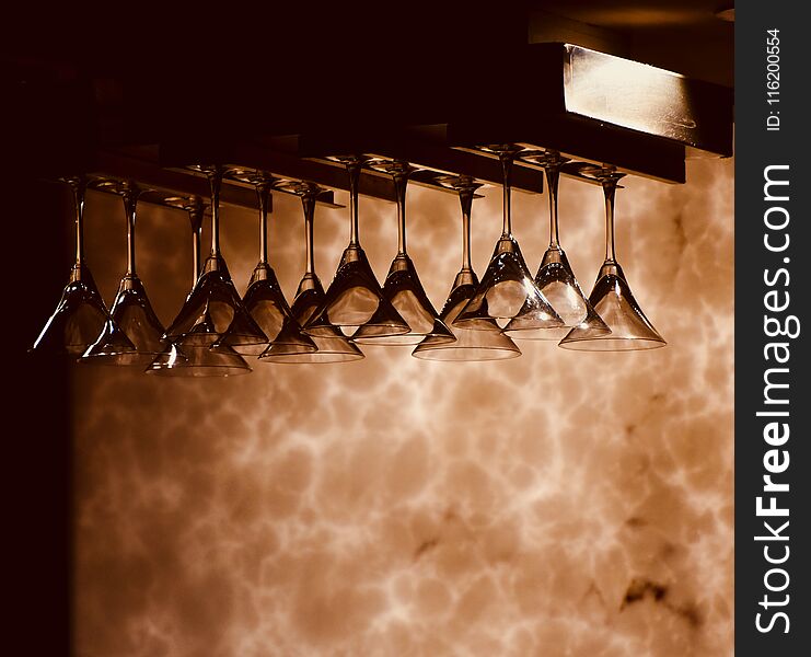 Beautiful hanging wine glasses of a bar isolated photograph