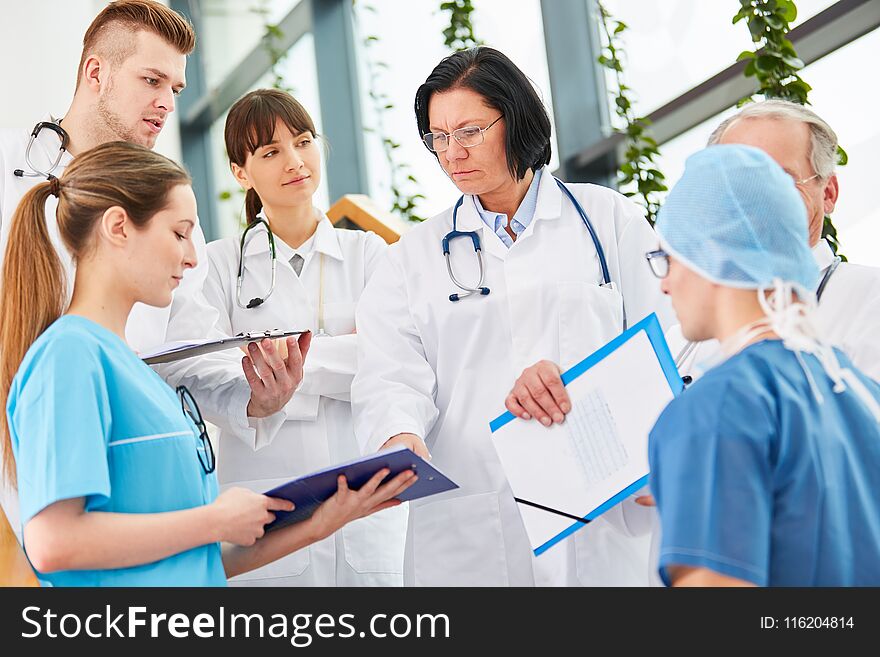 Team of doctors and chief physician with authority