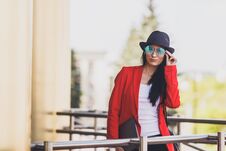 Portret Of Happy Hipster Young Woman With Laptop Wearing Sunglasses, Black Hat And Red Jacket. Student Girl With Laptop Royalty Free Stock Images
