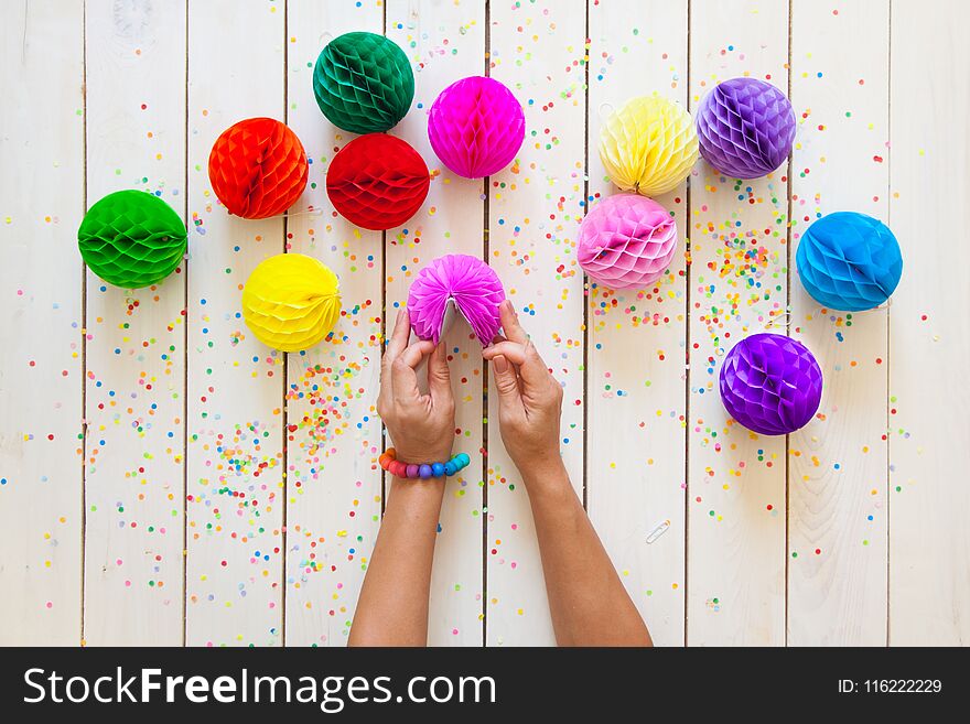 Paper Balls And Confetti In Bright Different Colors. White Wood