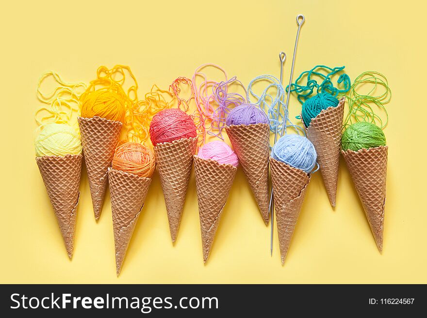 Balls Of Yarn Lie In A Waffle Cone For Ice Cream. Coloured Wool.