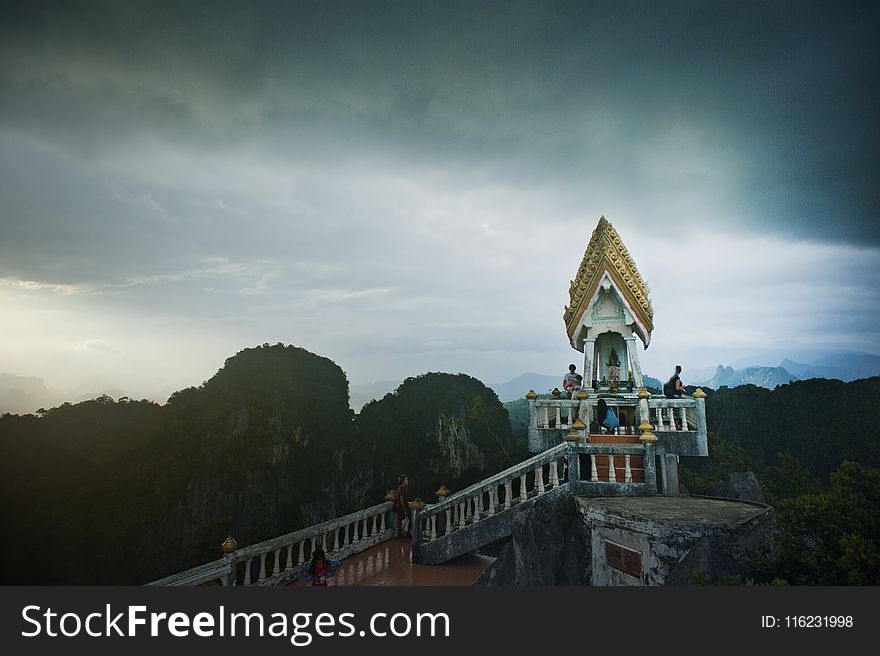 Aerial View Photography of Mountains Under Cloudy Sky