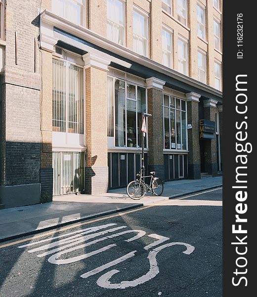 Black City Bicycle In Front Of Building