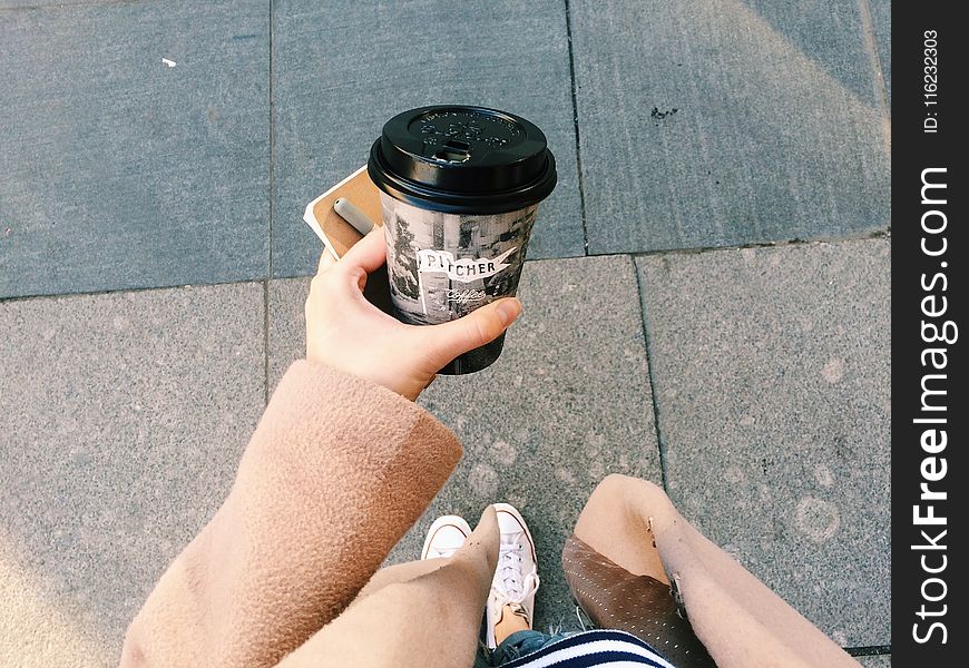 Person Holding Gray Disposable Cup