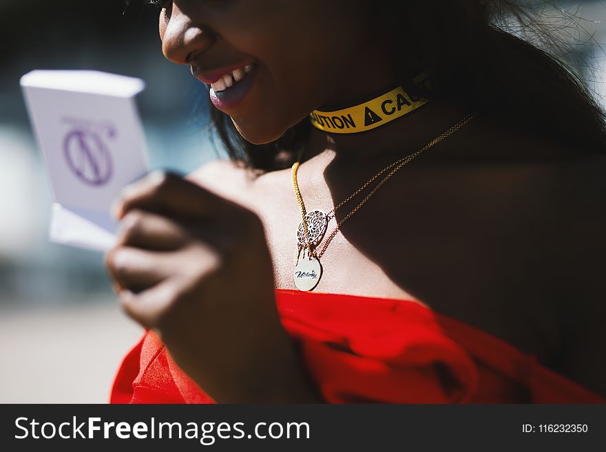 Woman in Red Strapless Dress in Macro Photography