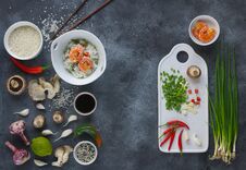 Asian Food On A Dark Background, Wok Rice With Shrimps And Mushrooms, During Preparation, Top View, Flatlay Stock Photo