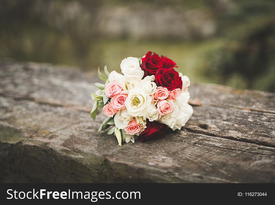 Beautiful wedding bouquet with different flowers, roses