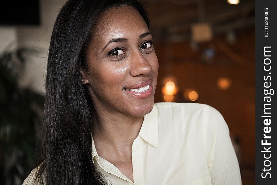 Close up portrait of a beautiful young african american woman smiling. Lifestyle concept.