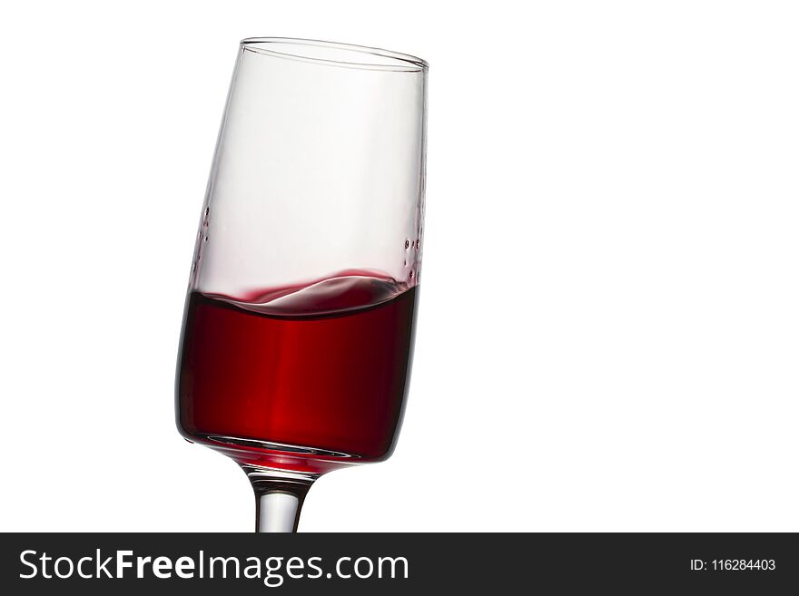 Dessert red wine splashing in an elegant glass bright alcoholic drink on a white background looks appetizing