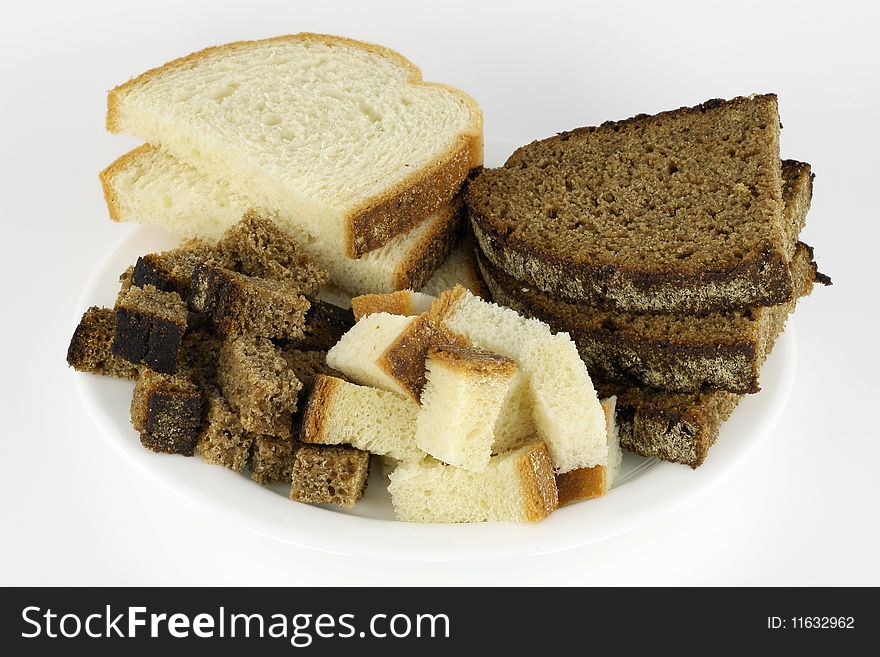 Slices of black rye and white white bread are prepared for to fry in oil. Slices of black rye and white white bread are prepared for to fry in oil.