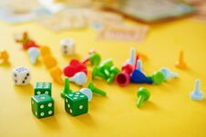 Dice, Chips And Cards On A Yellow Background Royalty Free Stock Images