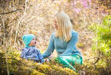 Happy Woman And Baby Girl In The Blooming Spring Forest With Rosemary Stock Photos