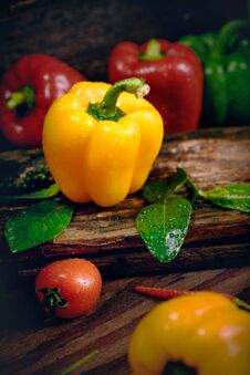 Bell Pepper With Vegetables On The Old Wooden Floor Stock Photo