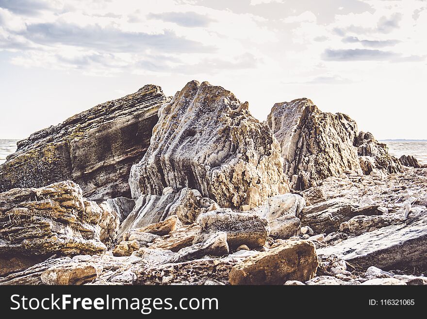 Pile of natural sandstone. Sandstone on the beach. Nature of Russia