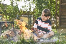 Boy Enjoy Campfire Stock Image