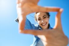 Portrait Of A Young Attractive Woman On The Blue Sky Background Stock Photos Portrait Of A Young Attractive Woman On The Blue Sky Background Stock Photos
