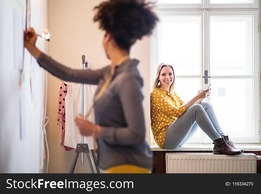 Young Creative Women With Smartphone In Studio, Startup Business.