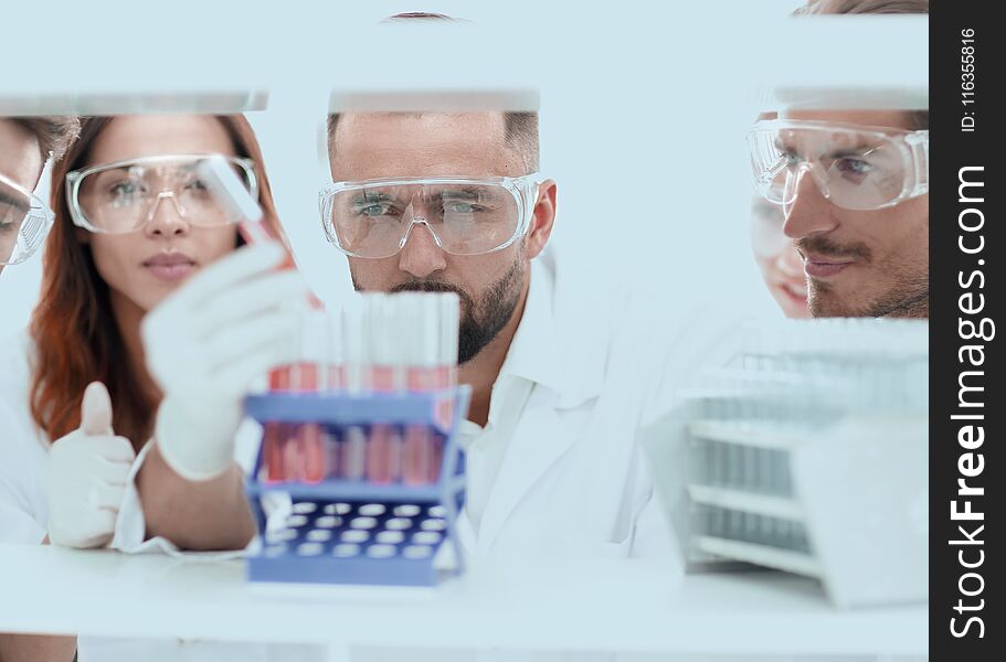 Closeup of a group of scientists and pharmacists in the laboratory.