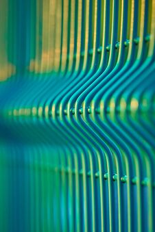 Green Wavy Mesh Fence Close Up. Can Be Used As A Background. Stock Image