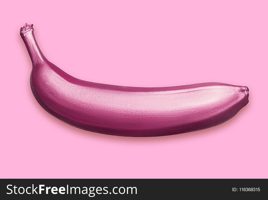 Purple metallic banana on a pink background. A modern creative concept. Contemporary art. Hand-painted fruit