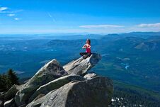 Young Woman Meditate On Rock Above Beautiful Valley. Royalty Free Stock Photos