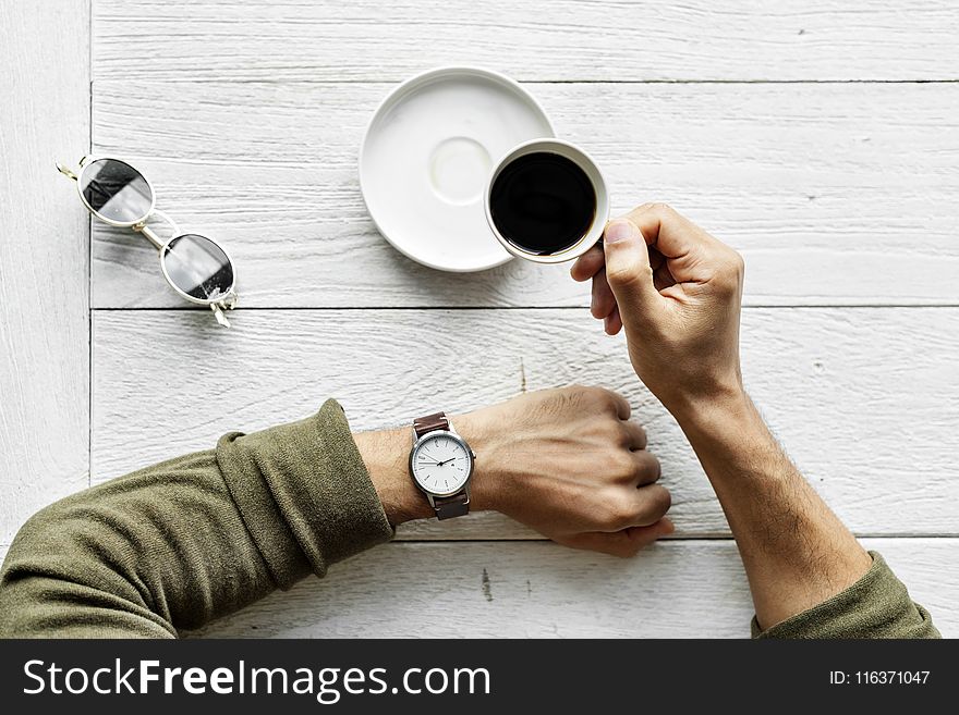 Person Holding Teacup