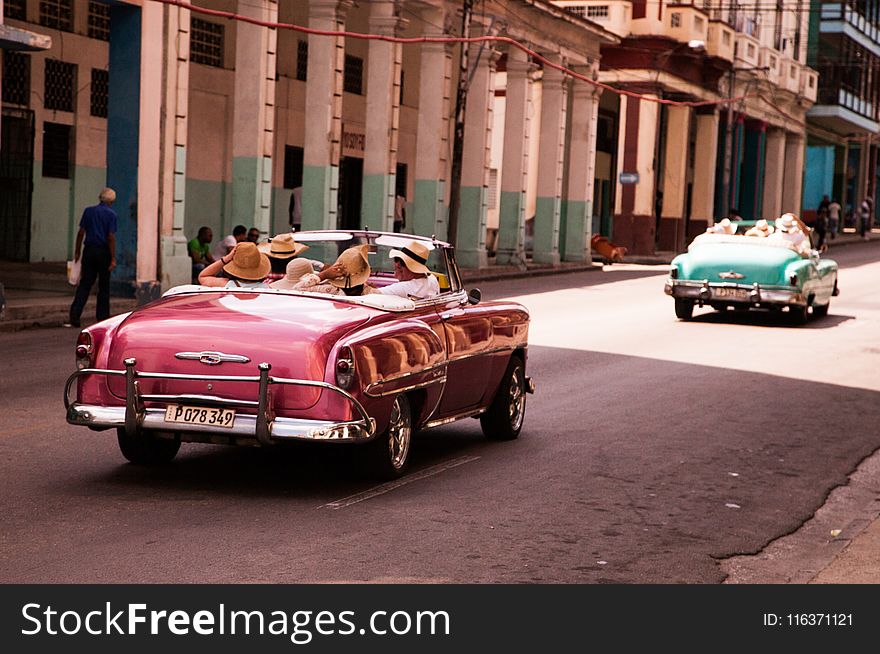 Girls Riding on Red Convertible Coupe