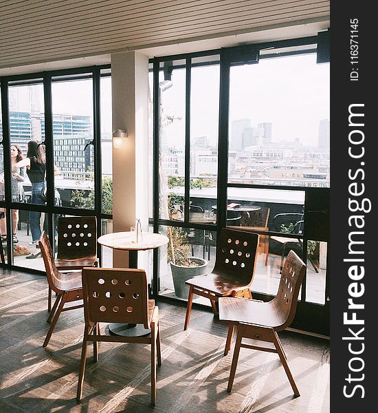 Empty Brown Table With Four Chairs Set